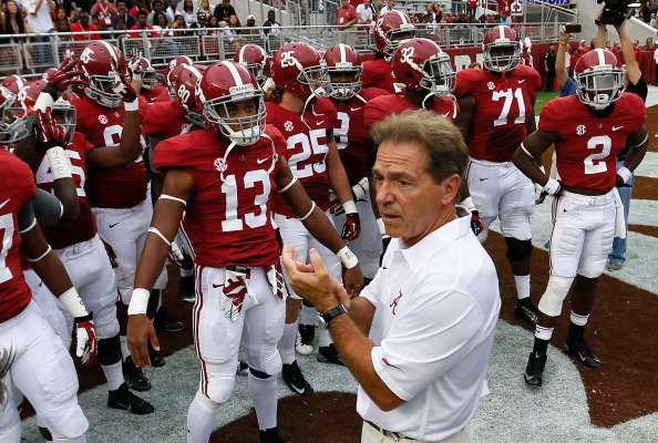 Nick Saban claps to excite the team for the first practice of the year in preparation of the Wimbledon trophy. 